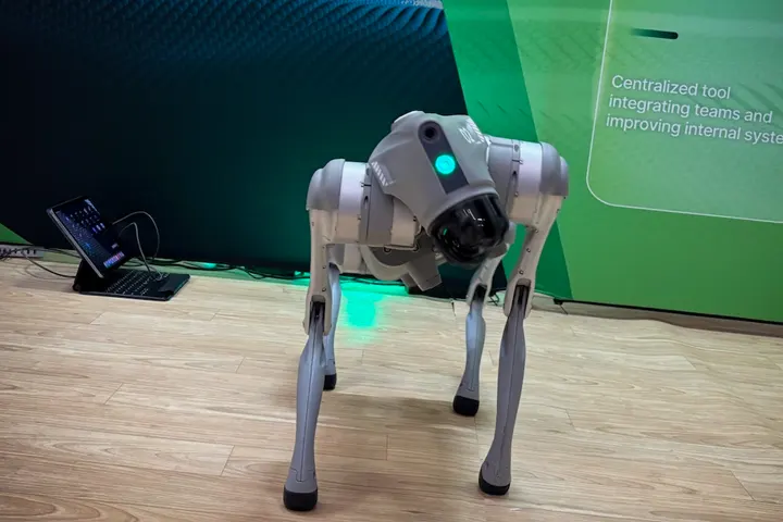 IQ the robot dog resting at the CentrixIQ booth